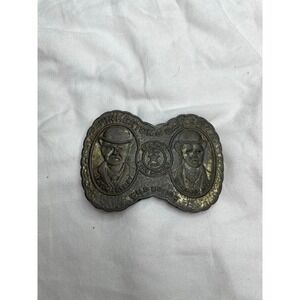 vintage belt buckle featuring "Pinkerton's Gallery" with images of Butch